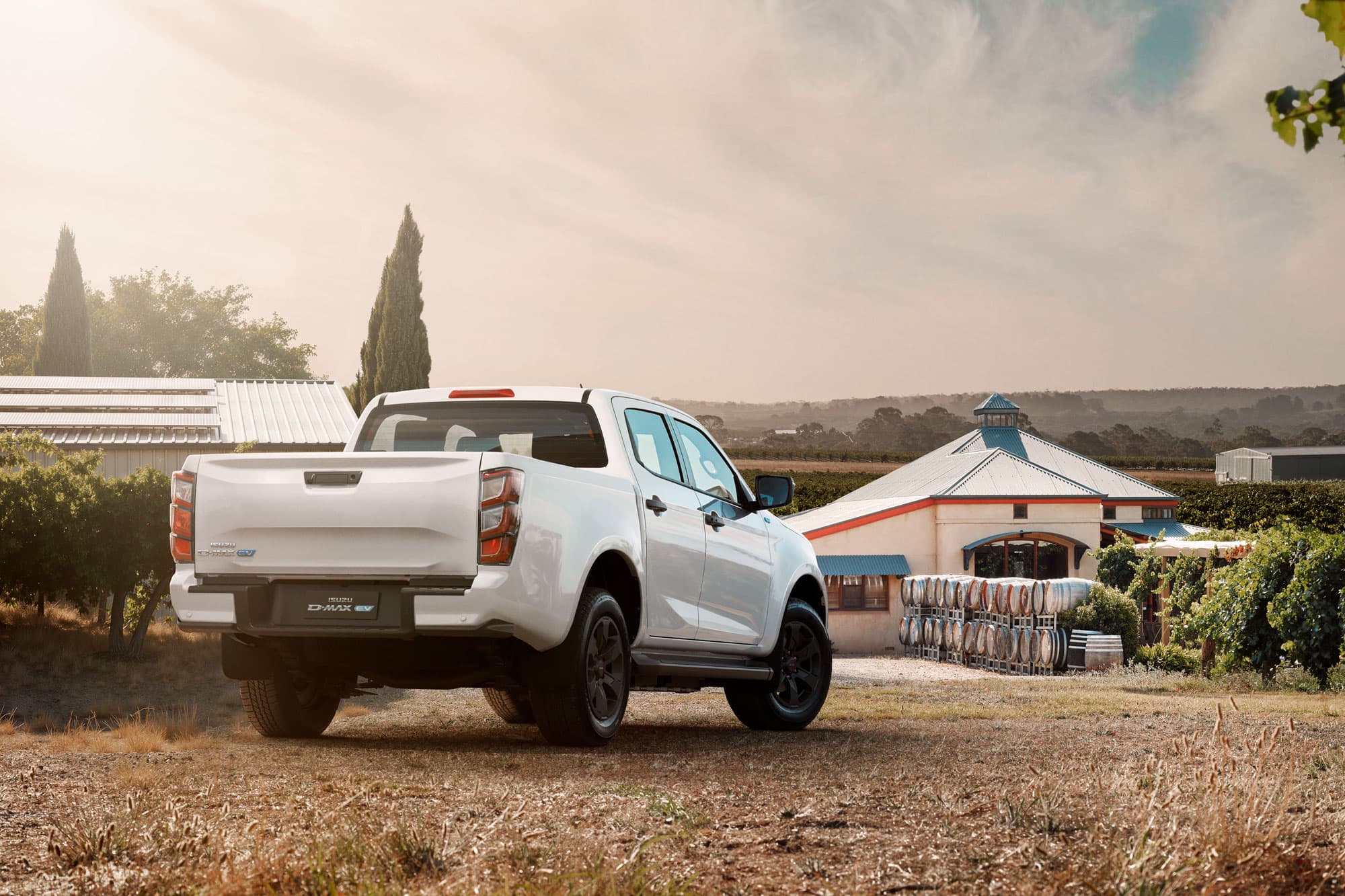 White Isuzu D-MAX EV Double Cab at a vineyard