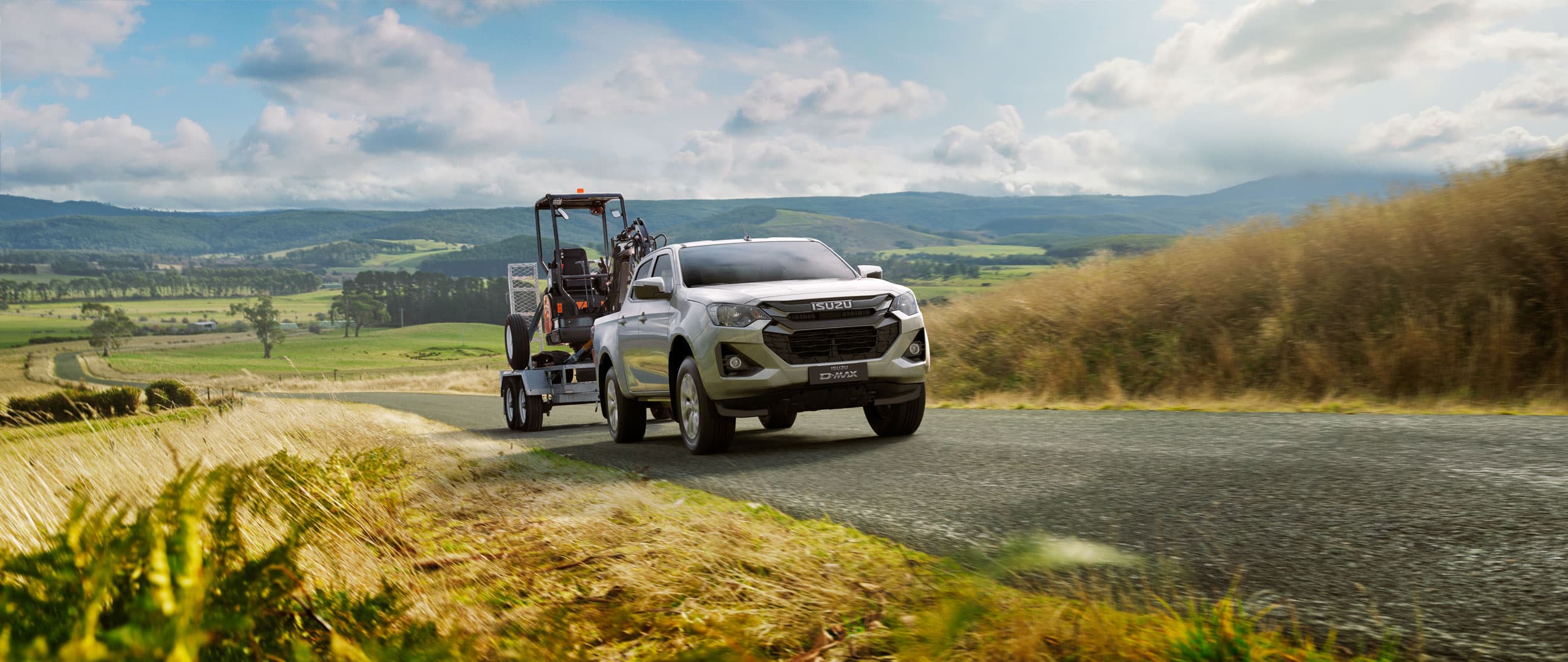 Front view on road with tow bar and vehicle attached